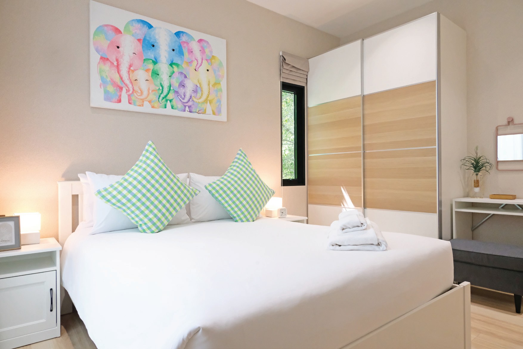 Bedroom with bed and wardrobe in a 46 sq.m. residence